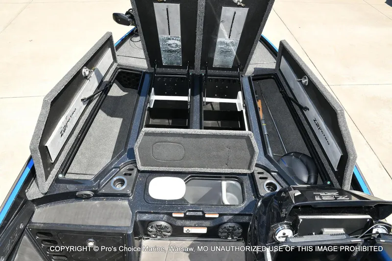 Slide: The Image of 2024 Nitro Z21 XL Pro Pack boat with open storage compartments and sleek design. - 7