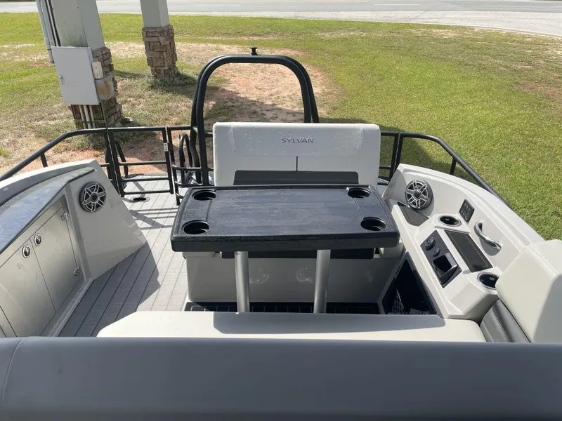 Slide: The Image of 2025 Sylvan G-3 DLZ DH boat interior with table and seating, featuring modern design elements. - 12