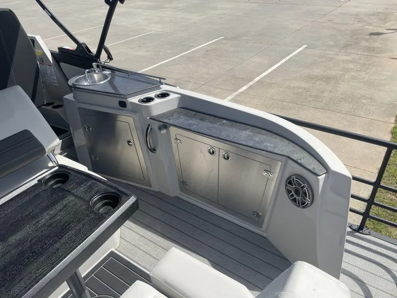 Slide: The Image of Interior of 2025 Sylvan G-3 DLZ DH boat with sleek cabinetry and seating. - 14