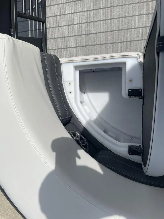 Slide: The Image of Interior of 2025 Sylvan G-3 DLZ DH boat, featuring white and gray seating. - 19