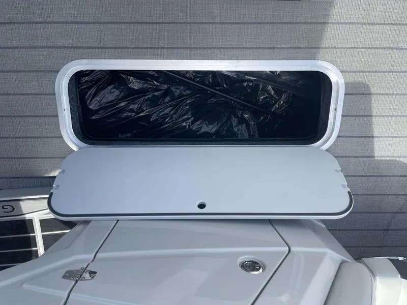 Slide: The Image of Open storage compartment on 2025 Sylvan G-3 DLZ DH boat. - 22
