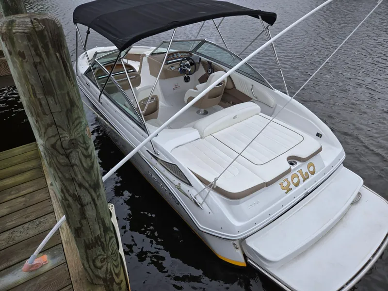 Slide: The Image of 2011 Cobalt 222 boat docked, featuring a sleek design and comfortable seating. - 12