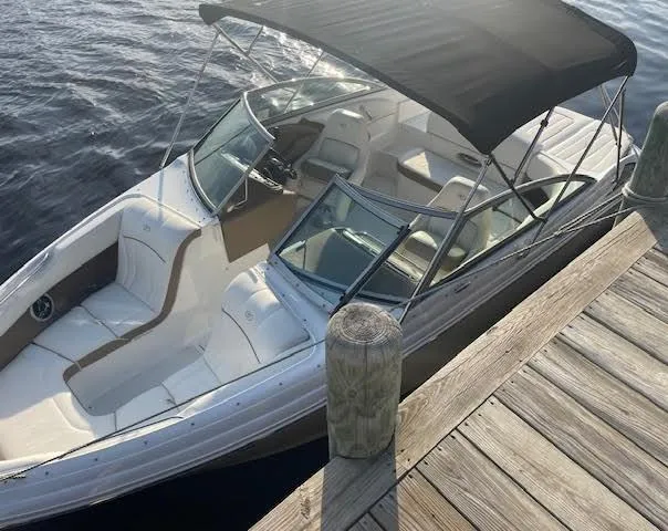 Slide: The Image of 2011 Cobalt 222 boat docked, featuring sleek design and spacious seating. - 6