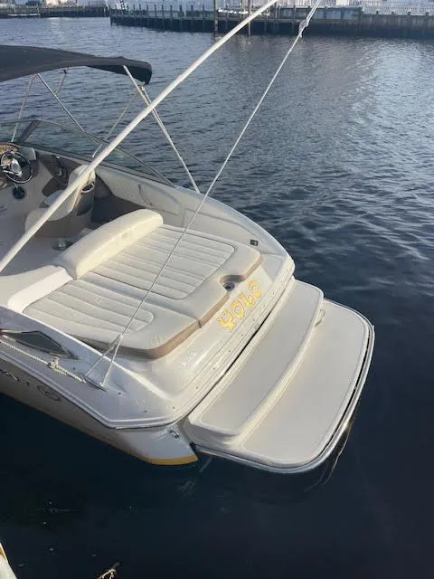 Slide: The Image of 2011 Cobalt 222 boat with swim platform, docked on calm water. - 8