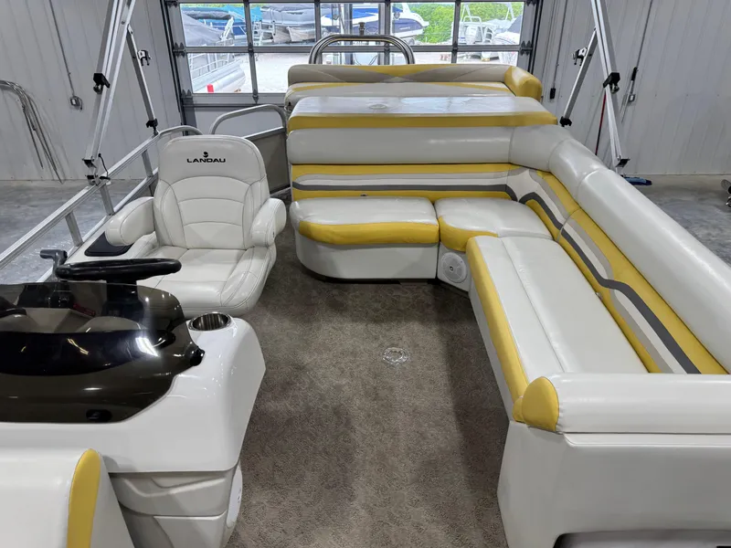 Slide: The Image of Interior of 2010 Landau 250 ATLANTIS boat with white and yellow seating. - 9
