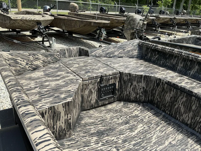 Slide: The Image of 2025 Reaper Boats 656 with camouflage design, displayed outdoors on gravel. - 3