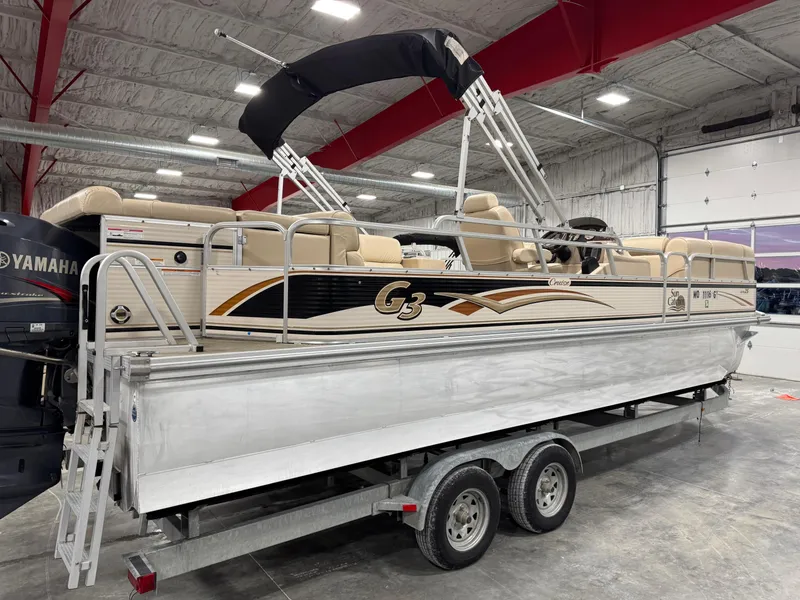 Slide: The Image of 2009 G3 25 ELITE pontoon boat on trailer in indoor storage facility. - 4