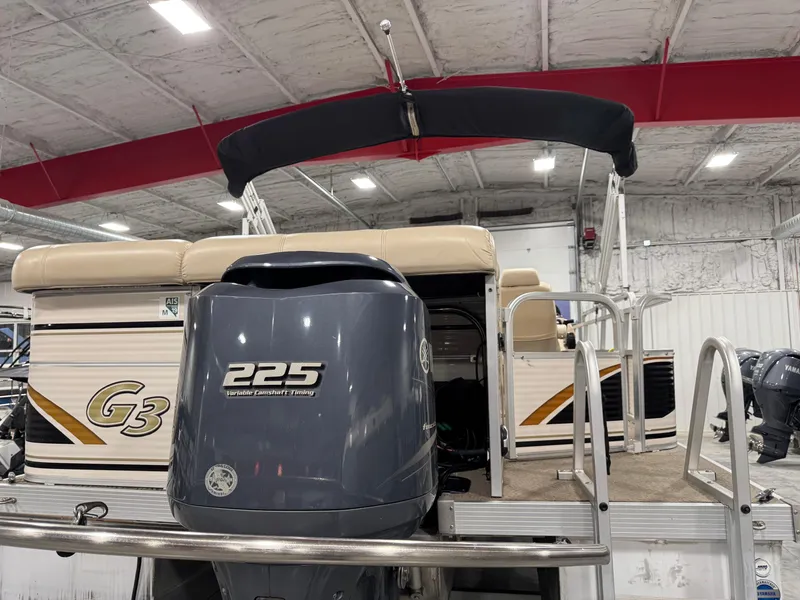 Slide: The Image of 2009 G3 25 ELITE pontoon boat with Yamaha 225 engine in indoor storage. - 6