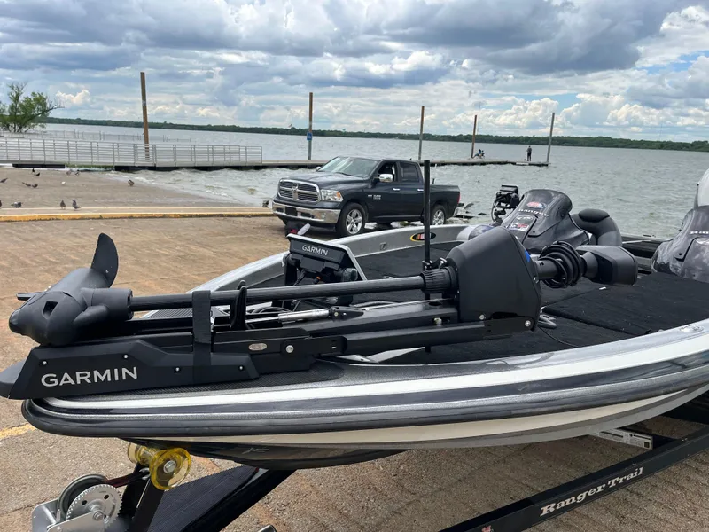 Slide: The Image of 2007 Ranger COMANCHE SERIES Z22 NASCAR boat with Garmin equipment at a lakeside dock. - 11