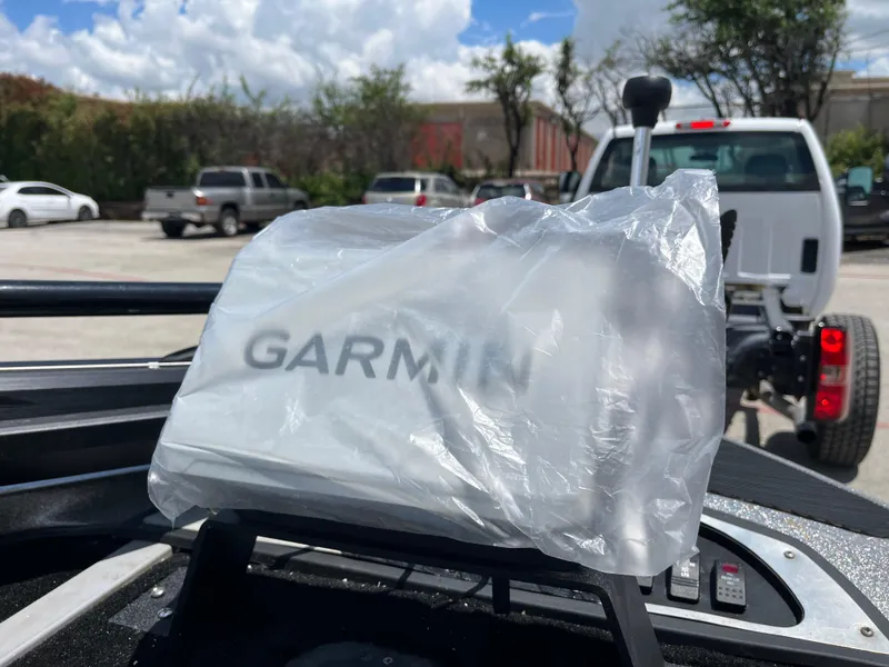 Slide: The Image of Garmin device on 2007 Ranger COMANCHE SERIES Z22 NASCAR boat, covered in plastic, outdoors. - 14