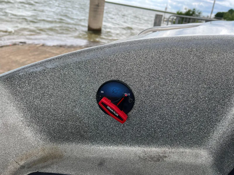 Slide: The Image of Close-up of a 2007 Ranger COMANCHE SERIES Z22 NASCAR boat control panel by the water. - 36