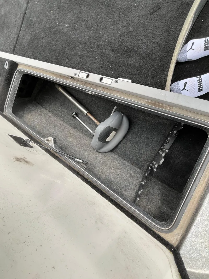 Slide: The Image of Storage compartment in a 2007 Ranger COMANCHE SERIES Z22 NASCAR boat, containing tools and equipment. - 37