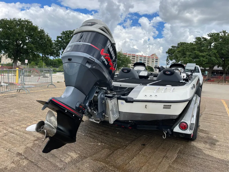 Slide: The Image of 2007 Ranger COMANCHE SERIES Z22 NASCAR boat with powerful outboard motor, parked outdoors. - 5