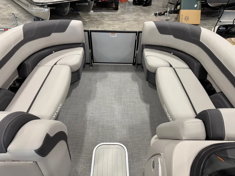 Slide: The Image of Interior of 2025 Sylvan L 5 boat with gray and black seating. - 10