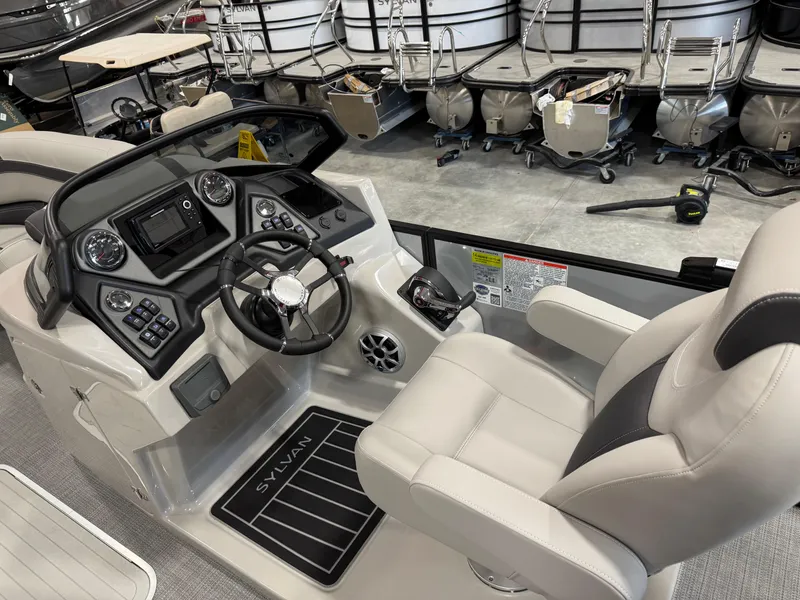 Slide: The Image of 2025 Sylvan L 5 boat cockpit with modern controls and comfortable seating. - 12