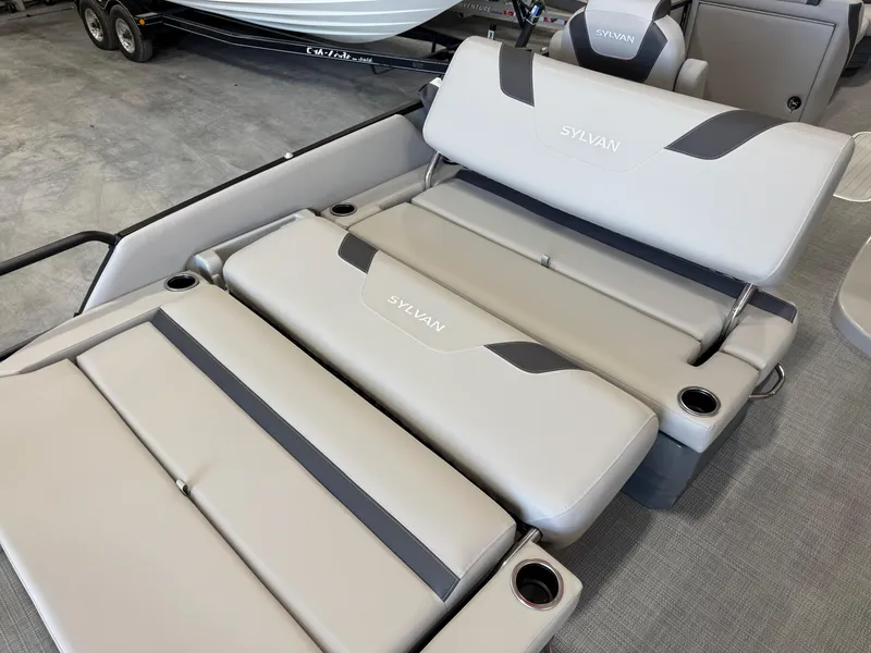 Slide: The Image of 2025 Sylvan L 5 boat interior with gray cushioned seating and cup holders. - 15