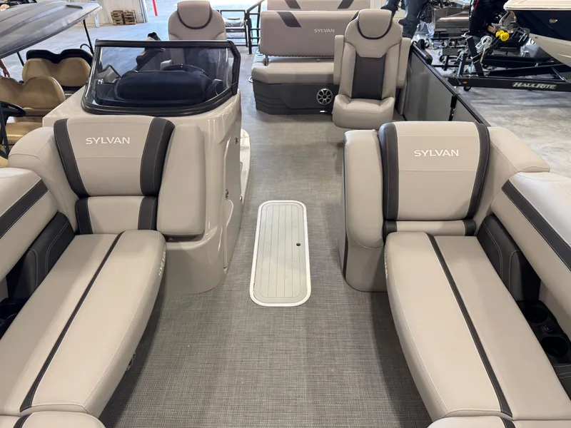 Slide: The Image of 2025 Sylvan L 5 boat interior with beige seating and modern design. - 19