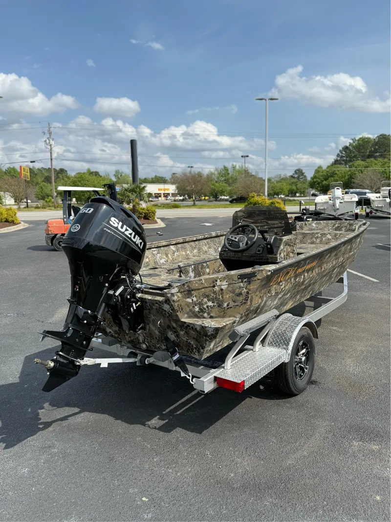 Slide: The Image of 2025 Excel 1751 Side Console River Warrior boat with Suzuki outboard motor on trailer. - 11
