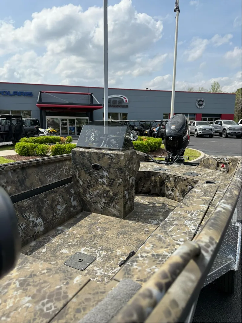 Slide: The Image of 2025 Excel 1751 Side Console River Warrior boat with camouflage design at dealership. - 14
