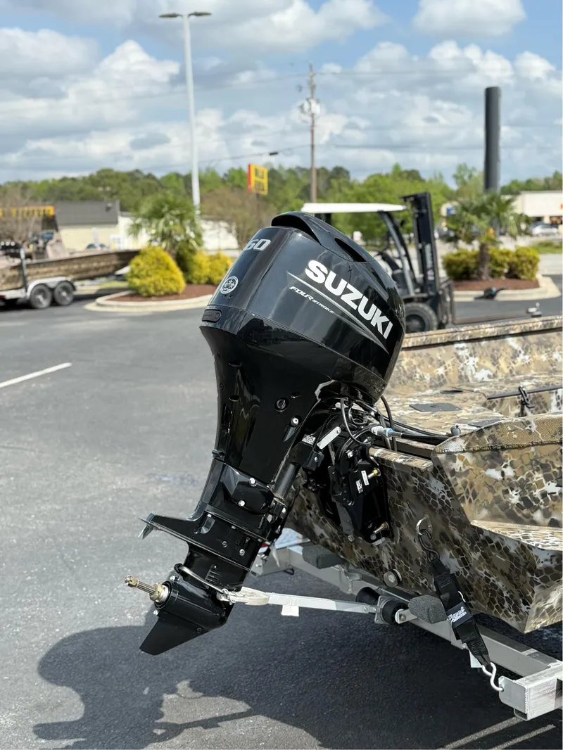 Slide: The Image of 2025 Excel 1751 Side Console River Warrior with Suzuki outboard motor. - 6