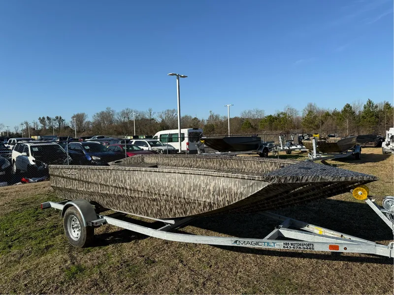 Slide: The Image of 2025 EDGE BOATS 656 SPORTSMAN on trailer, parked outdoors under clear blue sky. - 1