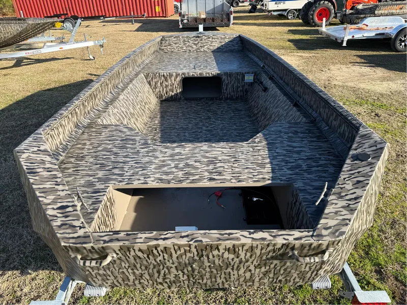 Slide: The Image of 2025 EDGE BOATS 656 SPORTSMAN with camouflage design on display outdoors. - 4