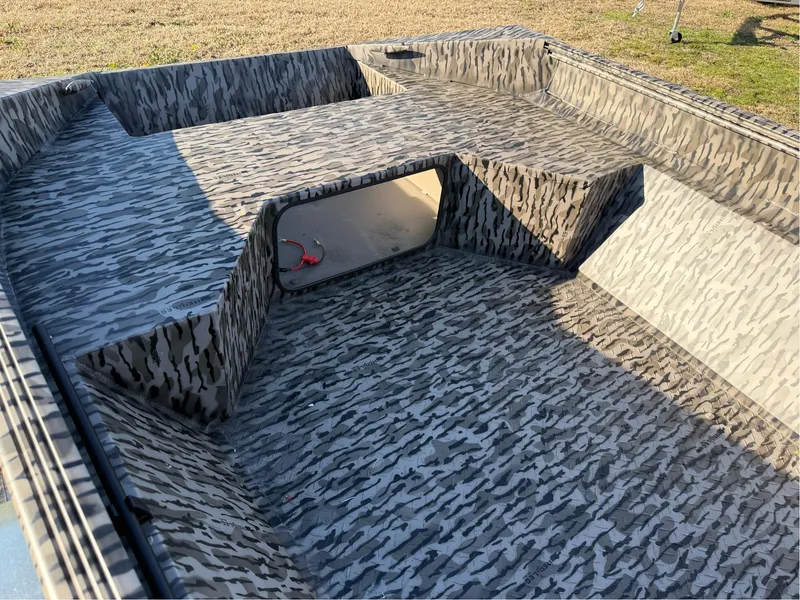 Slide: The Image of 2025 EDGE BOATS 656 SPORTSMAN interior with camouflage pattern, showcasing spacious design. - 5