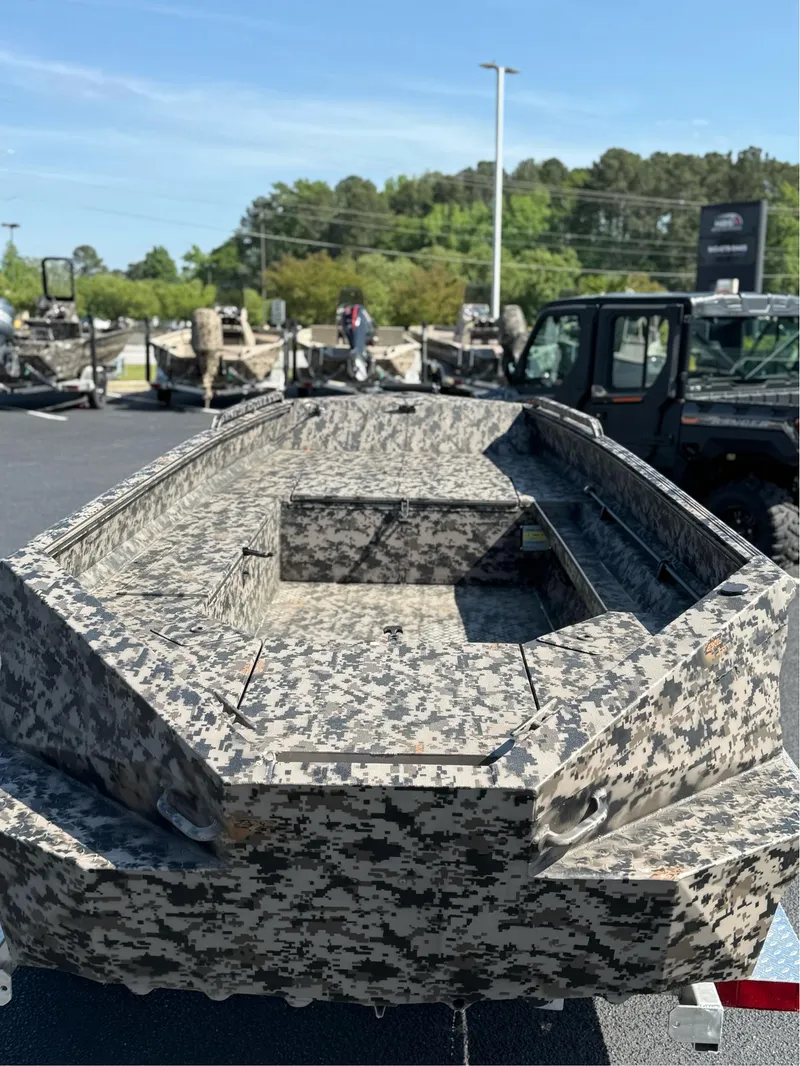 Slide: The Image of 2025 EDGE BOATS 653 DB with camouflage design, displayed outdoors on a sunny day. - 3