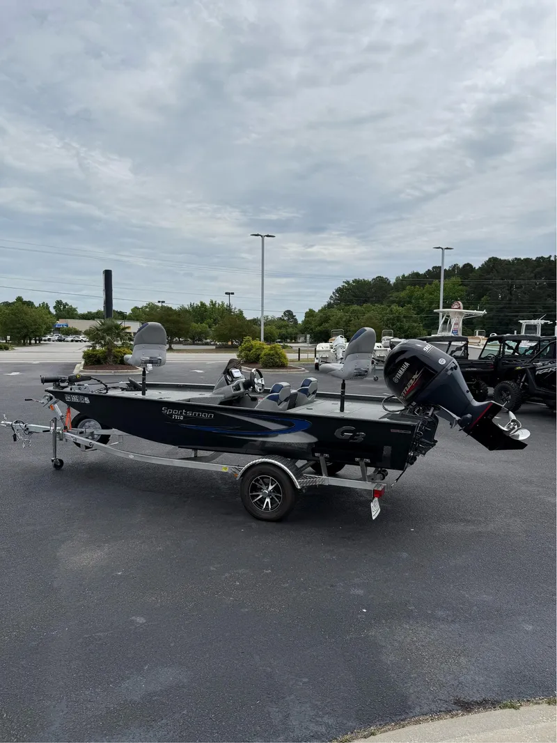 Slide: The Image of 2021 G3 Sportsman 1710 boat on trailer in parking lot, overcast sky. - 12