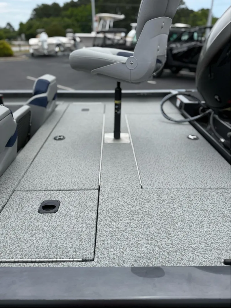 Slide: The Image of 2021 G3 Sportsman 1710 boat interior with seating and storage compartments. - 14