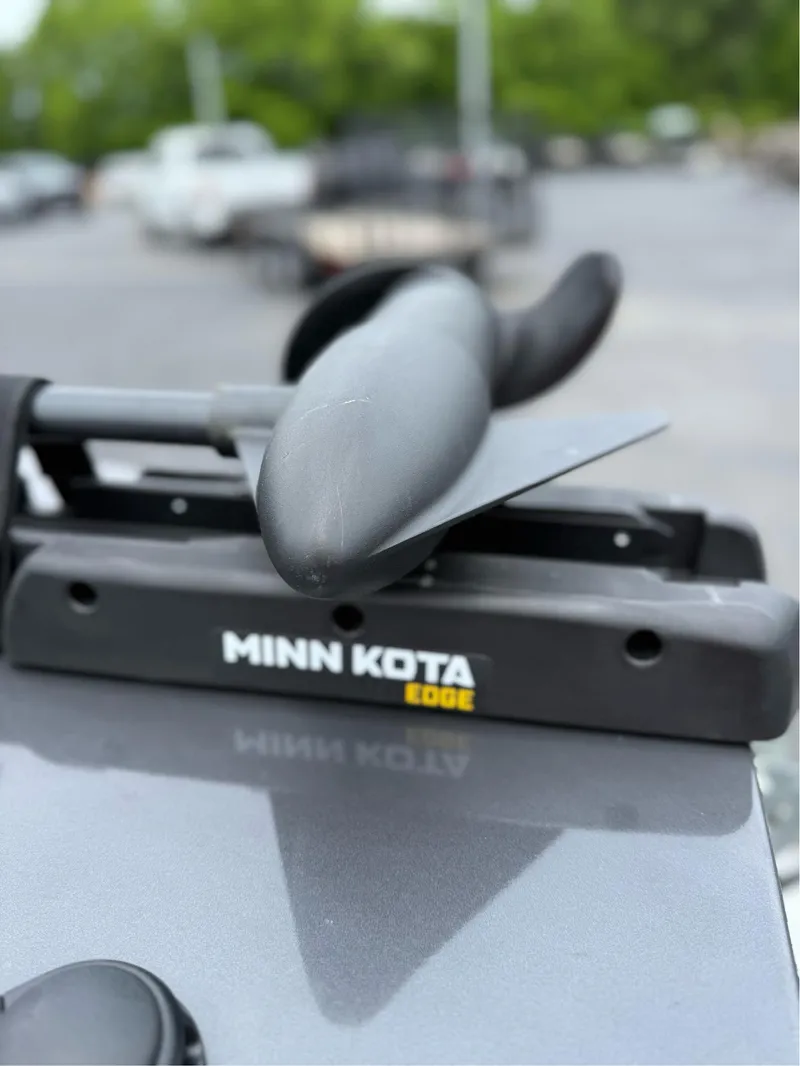 Slide: The Image of Minn Kota Edge trolling motor on 2021 G3 Sportsman 1710 boat, parked outdoors. - 5