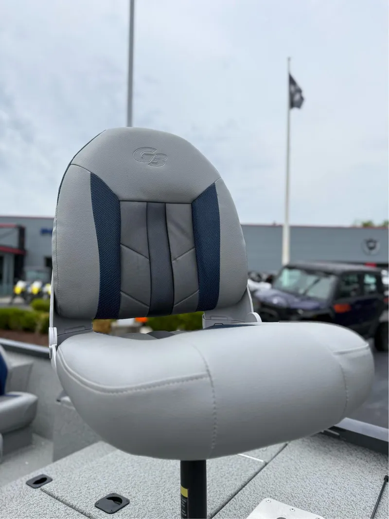Slide: The Image of 2021 G3 Sportsman 1710 boat seat, gray and blue, outdoors. - 6