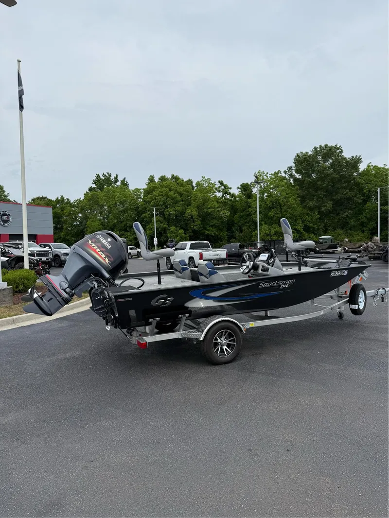 Slide: The Image of 2021 G3 Sportsman 1710 boat on trailer, parked outdoors near dealership. - 9