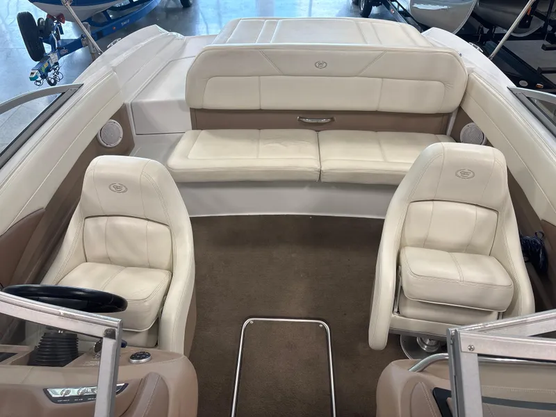Slide: The Image of Interior of a 2008 Cobalt 202 boat with white leather seating. - 10