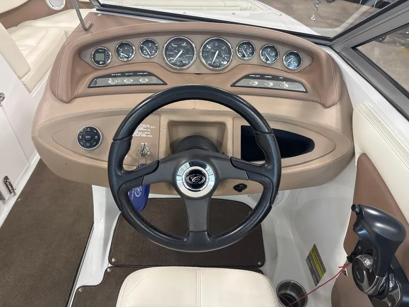 Slide: The Image of 2008 Cobalt 202 boat dashboard with steering wheel and instrument panel. - 13