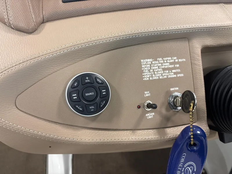 Slide: The Image of Control panel of a 2008 Cobalt 202 boat with ignition and navigation controls. - 14