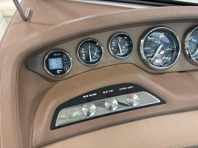 Slide: The Image of Dashboard of a 2008 Cobalt 202 boat with gauges and control switches. - 15