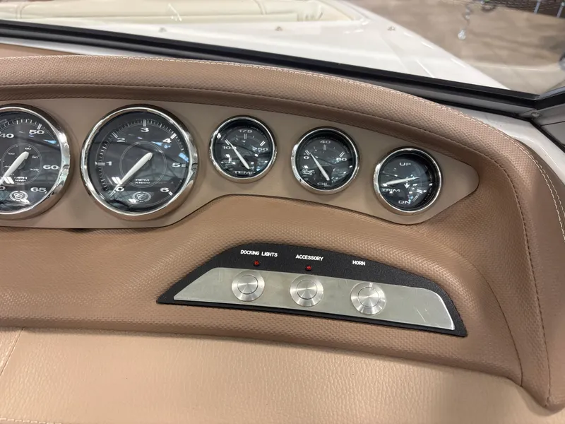 Slide: The Image of Dashboard of a 2008 Cobalt 202 boat with gauges and control buttons. - 16