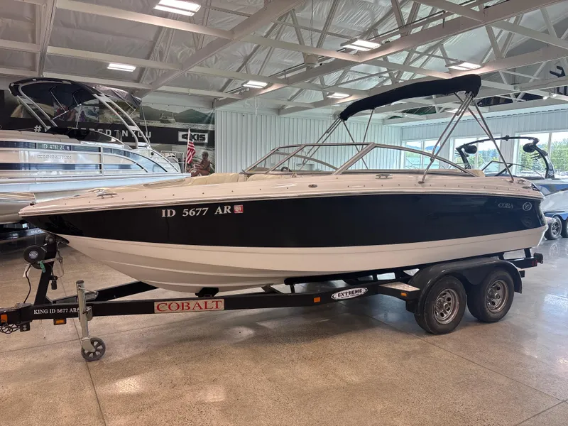 Slide: The Image of 2008 Cobalt 202 boat on trailer in showroom, black and white exterior. - 3