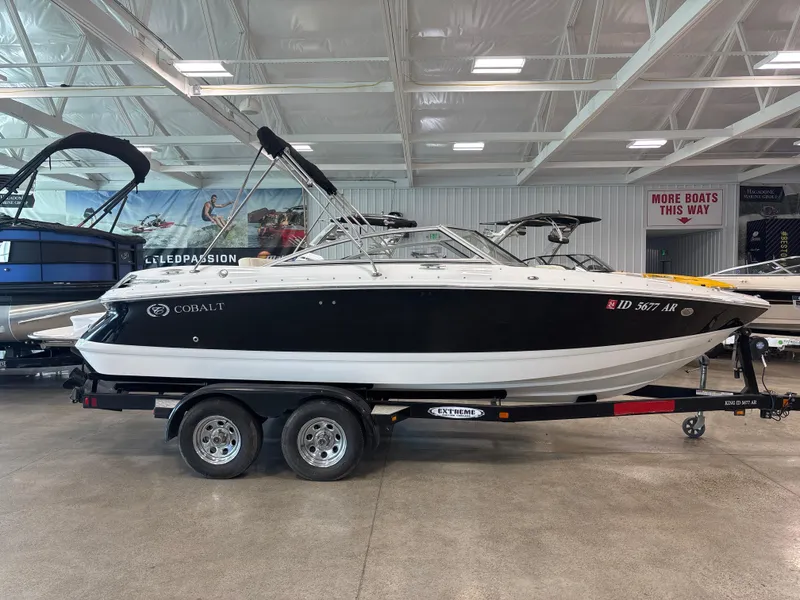 Slide: The Image of 2008 Cobalt 202 boat on trailer in showroom, black and white exterior. - 4