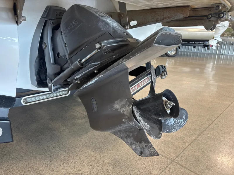 Slide: The Image of 2008 Cobalt 202 boat propeller and outdrive in a showroom setting. - 6