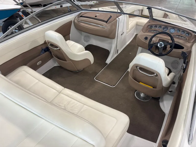 Slide: The Image of Interior of a 2008 Cobalt 202 boat with beige and white seating. - 8