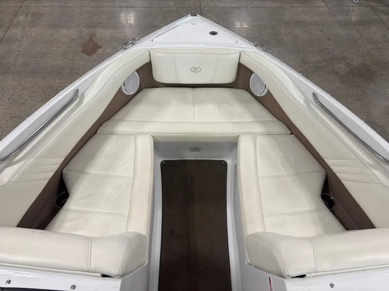 Slide: The Image of 2008 Cobalt 202 boat interior with white leather seating and brown accents. - 9