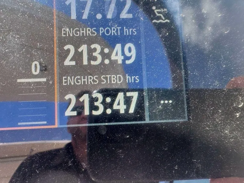 Slide: The Image of Display screen showing engine hours on a 2023 Sea Ray SLX 310 boat. - 5