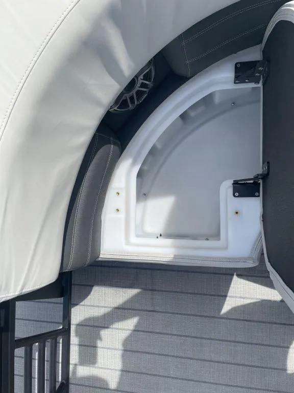 Slide: The Image of Storage compartment in 2025 Sylvan G-3 DLZ DH boat with cushioned seating. - 17