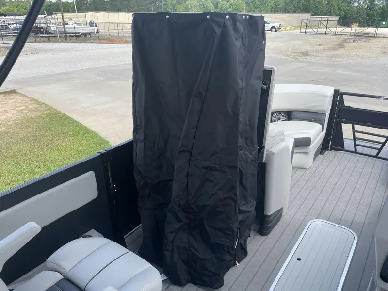 Slide: The Image of 2025 Sylvan G-3 DLZ DH boat interior with seating and privacy curtain. - 20