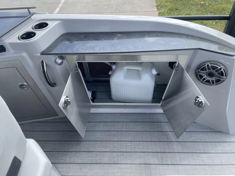 Slide: The Image of Interior of 2025 Sylvan G-3 DLZ DH boat with storage compartment open. - 22