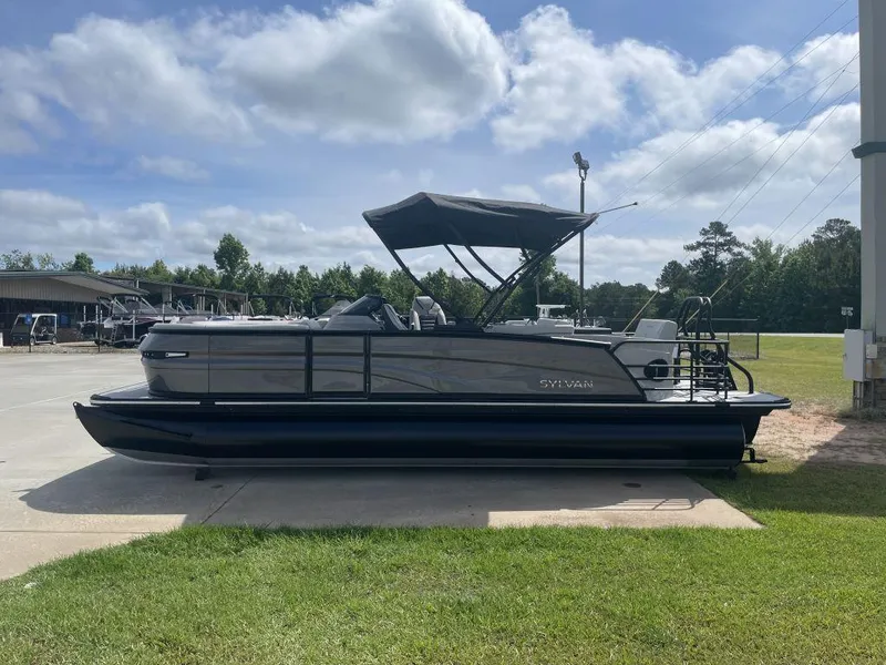 Slide: The Image of 2025 Sylvan G-3 DLZ DH pontoon boat parked outdoors on a sunny day. - 3