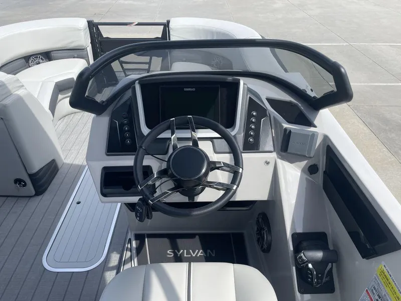Slide: The Image of 2025 Sylvan G-3 DLZ DH boat dashboard with modern steering and controls. - 6