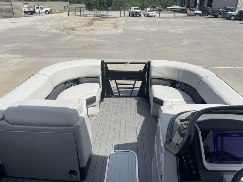 Slide: The Image of 2025 Sylvan G-3 DLZ DH pontoon boat interior with plush seating and modern dashboard. - 9